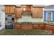 Gourmet kitchen featuring granite countertops, stainless steel appliances, and custom cabinetry at 2106 Yellowstone Dr, Fort Mill, SC 29707