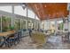 Inviting sunroom filled with natural light, stone floors, and comfortable seating areas at 2106 Yellowstone Dr, Fort Mill, SC 29707