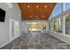 Bright sunroom features stone floors, wood ceiling, and large windows with outdoor views at 2106 Yellowstone Dr, Fort Mill, SC 29707