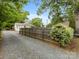Gated backyard area features a parking area and privacy fence at 2110 Winter St, Charlotte, NC 28205