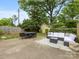 Inviting backyard with patio seating and lush greenery, perfect for outdoor entertaining and relaxation at 2110 Winter St, Charlotte, NC 28205
