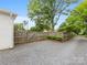 Gated backyard area features a parking area and privacy fence at 2110 Winter St, Charlotte, NC 28205