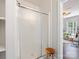 Bathroom featuring a glass-enclosed shower, adjacent to a serene space with natural light and decor at 2110 Winter St, Charlotte, NC 28205