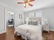 Serene bedroom with a queen-sized bed, soft linens, hardwood floors, and natural lighting at 2110 Winter St, Charlotte, NC 28205