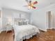 Serene bedroom with a queen-sized bed, soft linens, hardwood floors, and natural lighting at 2110 Winter St, Charlotte, NC 28205