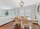 Inviting dining room featuring a rustic wood table with seating for six and a modern chandelier at 2110 Winter St, Charlotte, NC 28205