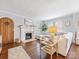 Bright living room with hardwood floors, white sectional sofa, a fireplace, and natural light at 2110 Winter St, Charlotte, NC 28205