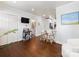 Bright living room features bar, hardwood floors, and a view into a bathroom at 2110 Winter St, Charlotte, NC 28205