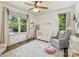 Bright and airy Bedroom with a white crib, comfortable rocking chair, and lots of natural light streaming through the windows at 2121 Club Rd, Charlotte, NC 28205