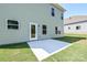 Backyard featuring a concrete patio and a grassy area with a house's exterior at 2206 Catawba Trace Dr, Catawba, NC 28609