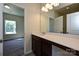 Well-lit bathroom with a large mirror, vanity, and doorway that leads into a bedroom at 2206 Catawba Trace Dr, Catawba, NC 28609