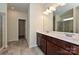 Bathroom featuring double vanity sinks, dark wood cabinetry and glass enclosed shower at 2206 Catawba Trace Dr, Catawba, NC 28609
