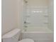 Clean bathroom with tub, showerhead, and a toilet in a neutral color scheme at 2206 Catawba Trace Dr, Catawba, NC 28609