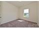 Bedroom with carpet flooring, natural light and a view of the outdoors at 2206 Catawba Trace Dr, Catawba, NC 28609