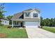 Charming two-story home featuring a two-car garage, and a well-manicured lawn at 2206 Catawba Trace Dr, Catawba, NC 28609