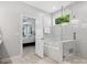 Bright bathroom featuring a glass enclosed shower, soaking tub, and doorway to the main bedroom at 2467 Chatham Dr, Fort Mill, SC 29707