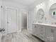 Bright bathroom with dual sinks, modern vanity, tile floors, and separate toilet area at 2467 Chatham Dr, Fort Mill, SC 29707