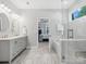 Luxurious bathroom with double vanity, soaking tub, walk-in shower, and access to the main bedroom at 2467 Chatham Dr, Fort Mill, SC 29707
