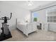 Bright bedroom with white walls, carpet floors, a ceiling fan, and a large window that provides natural light at 2467 Chatham Dr, Fort Mill, SC 29707