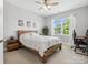 Bedroom featuring a wood frame bed, neutral colored walls, and bright natural light at 2467 Chatham Dr, Fort Mill, SC 29707