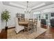 Elegant dining room features hardwood floors, tray ceilings, and a stylish chandelier at 2467 Chatham Dr, Fort Mill, SC 29707