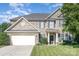 Charming two-story brick home with a well-manicured lawn and inviting entrance at 2467 Chatham Dr, Fort Mill, SC 29707