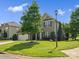 Charming two-story brick home with a manicured lawn and inviting curb appeal in a suburban neighborhood at 2467 Chatham Dr, Fort Mill, SC 29707