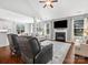 Spacious living room with hardwood floors, fireplace, and comfortable seating for relaxing and entertaining at 2467 Chatham Dr, Fort Mill, SC 29707