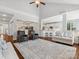 Open-concept living room featuring hardwood floors, neutral decor, and seamless flow to the kitchen at 2467 Chatham Dr, Fort Mill, SC 29707