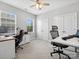 An office space featuring dual workstations, comfortable chairs, natural light, and ample storage at 2467 Chatham Dr, Fort Mill, SC 29707