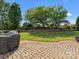 Backyard featuring a brick paver patio, a lush lawn, and mature landscaping at 2467 Chatham Dr, Indian Land, SC 29707