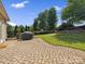 Backyard with brick paver patio and well-maintained lawn at 2467 Chatham Dr, Indian Land, SC 29707