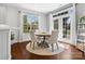 Bright dining area with hardwood floors, round table, and access to outdoor space at 2467 Chatham Dr, Indian Land, SC 29707