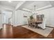 Dining room with hardwood floors, elegant chandelier, and wainscoting at 2467 Chatham Dr, Indian Land, SC 29707