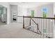 Upstairs hallway featuring natural light and decorative chandelier at 2467 Chatham Dr, Indian Land, SC 29707