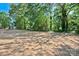 Expansive backyard with freshly laid straw, offering potential for landscaping and outdoor activities at 2502-2504 Glendale Ave, Kannapolis, NC 28081