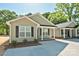 Charming home exterior showcasing green siding, black shutters, and a well-maintained yard at 2502-2504 Glendale Ave, Kannapolis, NC 28081