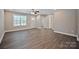 Bright, open living room with modern ceiling fan, neutral paint, and hardwood flooring at 2502-2504 Glendale Ave, Kannapolis, NC 28081