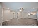 Open-concept living area featuring hardwood flooring and views of a modern bathroom and kitchen at 2502-2504 Glendale Ave, Kannapolis, NC 28081