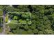 An aerial view of a cozy home surrounded by trees, set within property boundaries at 2603 Mary Ave, Gastonia, NC 28052