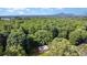 An aerial view of a cozy home nestled in a peaceful woodland setting near mountains at 2603 Mary Ave, Gastonia, NC 28052