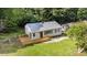 Aerial view of the home featuring a deck and mature trees at 2603 Mary Ave, Gastonia, NC 28052
