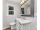 Bathroom with white vanity, framed mirror and window for natural light at 2603 Mary Ave, Gastonia, NC 28052