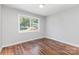 Bright bedroom features hardwood floors and a sun-filled window at 2603 Mary Ave, Gastonia, NC 28052