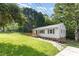 A quaint home with a lush green lawn, complemented by a wooden deck and a stone pathway at 2603 Mary Ave, Gastonia, NC 28052