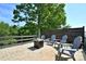 Cozy backyard patio with a fire pit and outdoor seating at 262 Country Lake Dr, Mooresville, NC 28115