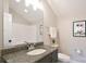 Bathroom with granite countertop, decorative mirror, and vanity at 262 Country Lake Dr, Mooresville, NC 28115