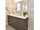 Bathroom vanity features granite countertop, gray cabinets, and large mirror at 262 Country Lake Dr, Mooresville, NC 28115