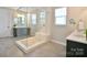 Modern bathroom with glass shower, tiled floors, and double vanity at 262 Country Lake Dr, Mooresville, NC 28115