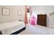 Cozy bedroom featuring a twin bed, pink play tent and dark wood dresser at 262 Country Lake Dr, Mooresville, NC 28115